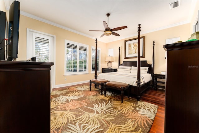 bedroom with wood-type flooring, ceiling fan, and crown molding