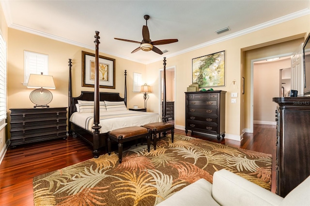 bedroom with dark hardwood / wood-style flooring and ornamental molding