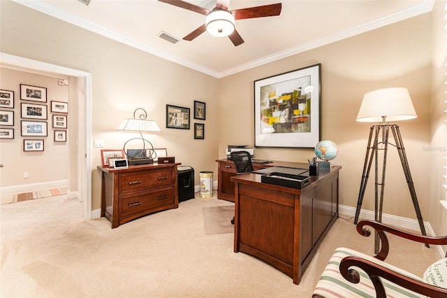 office featuring ceiling fan, crown molding, and light colored carpet