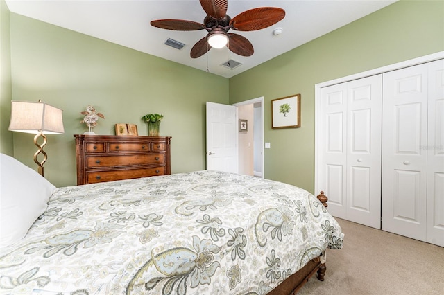 carpeted bedroom featuring a closet and ceiling fan