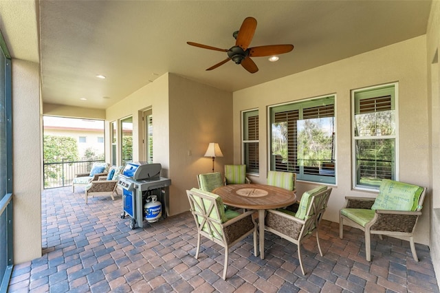 view of patio featuring ceiling fan and grilling area