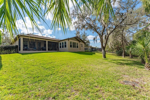 view of yard featuring a sunroom