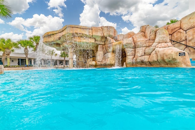 view of pool featuring pool water feature