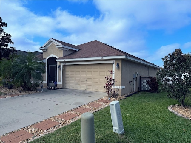 view of front of property featuring a front yard and a garage