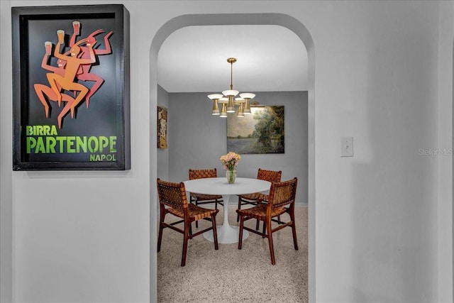 dining space featuring an inviting chandelier