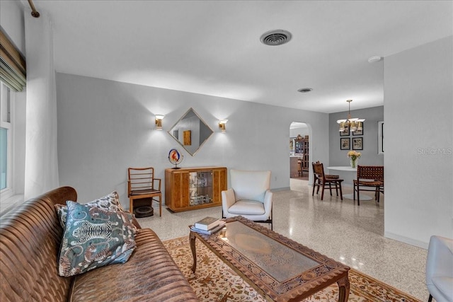 living room with an inviting chandelier