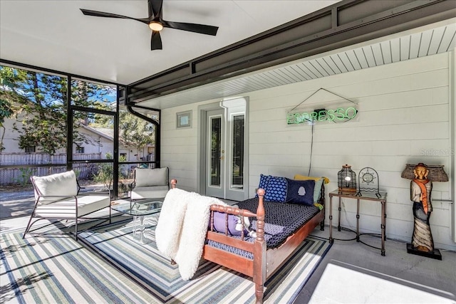 sunroom / solarium with ceiling fan