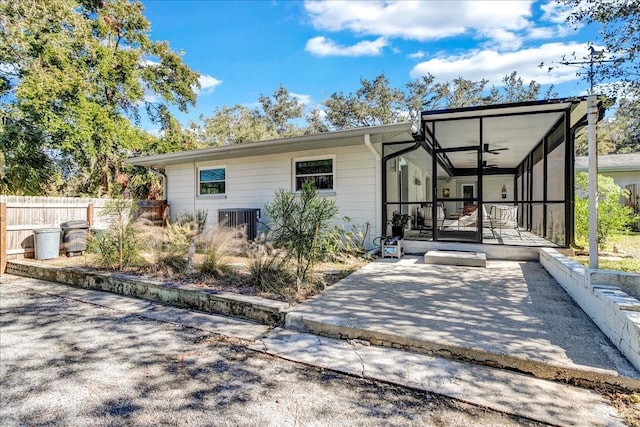 back of property with central AC, a patio, and ceiling fan