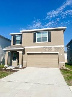 front of property with a garage