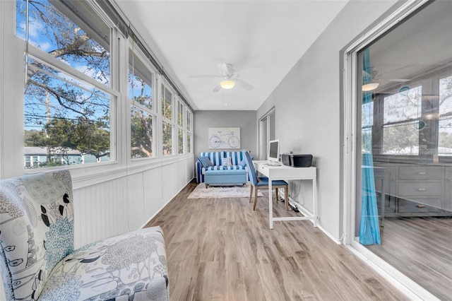 sunroom / solarium featuring ceiling fan and a wealth of natural light