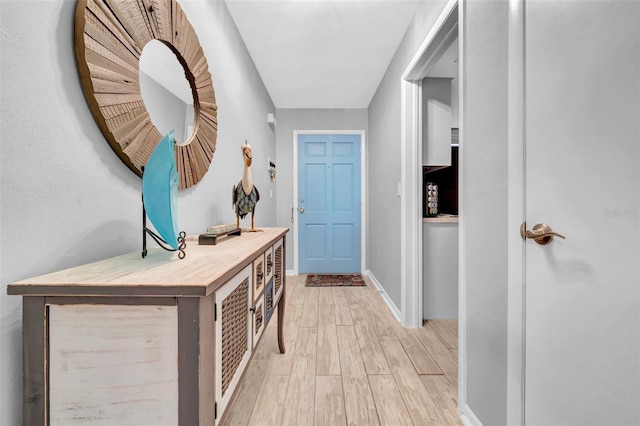 foyer entrance with light wood-type flooring