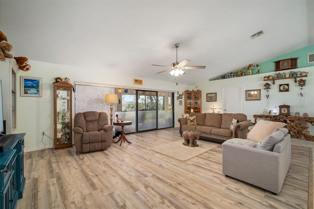 living room featuring vaulted ceiling, ceiling fan, and light hardwood / wood-style floors