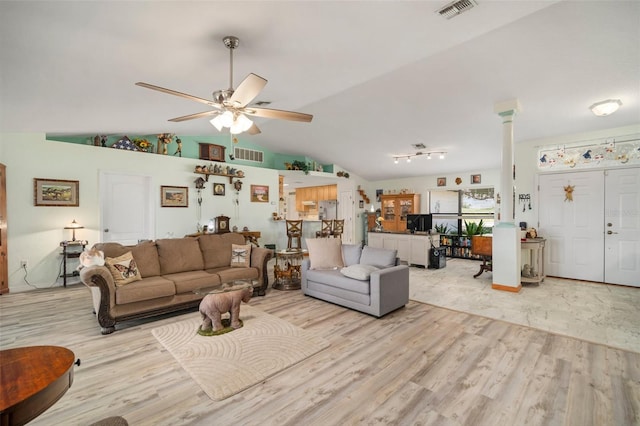 living room with lofted ceiling, light hardwood / wood-style floors, and ceiling fan