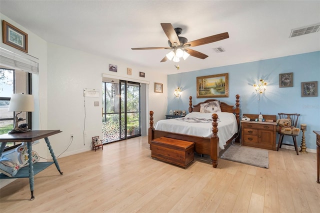 bedroom featuring light hardwood / wood-style flooring, ceiling fan, and access to outside