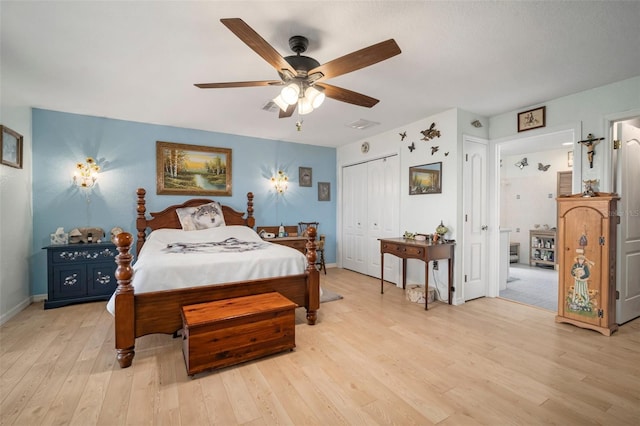 bedroom with ceiling fan, light wood-type flooring, and a closet