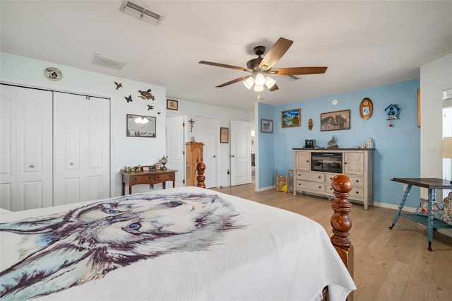 bedroom with ceiling fan, a closet, and light wood-type flooring