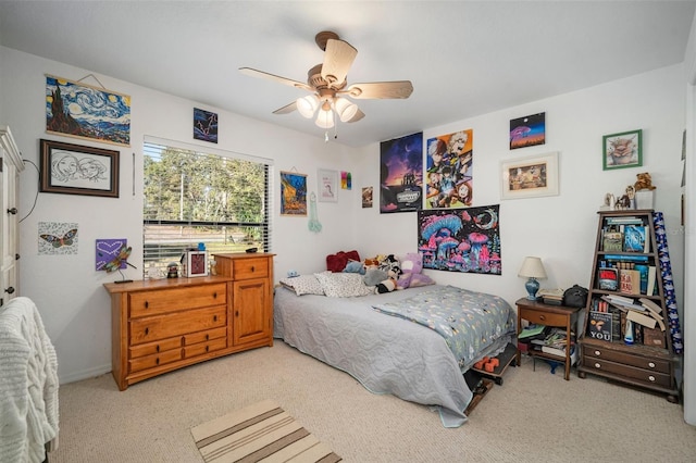 bedroom featuring ceiling fan and light carpet