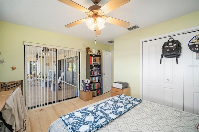 bedroom with light hardwood / wood-style floors, access to exterior, ceiling fan, and a closet