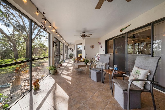 sunroom / solarium with ceiling fan