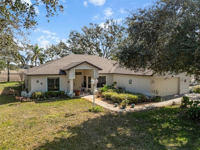 ranch-style home with a garage and a front yard