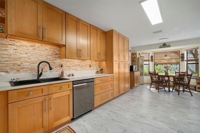 1472 Ivydale Rd, Spring Hill, FL 34606 - kitchen featuring a sink, dishwasher, light countertops, backsplash, and light marble finish flooring
