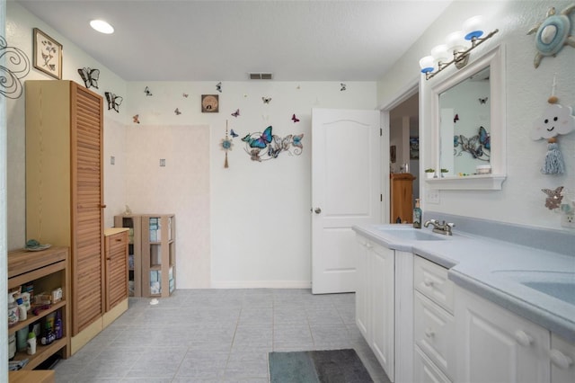 1472 Ivydale Rd, Spring Hill, FL 34606 - bathroom with tile patterned floors and double vanity
