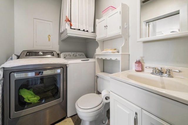 bathroom with separate washer and dryer and vanity