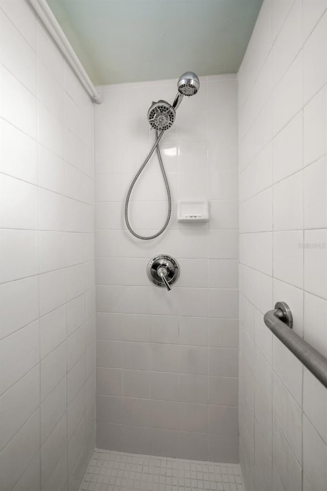 bathroom with tiled shower