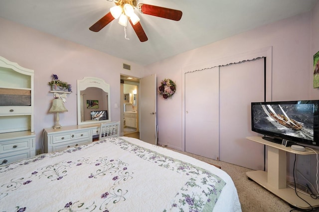 bedroom with ceiling fan and a closet