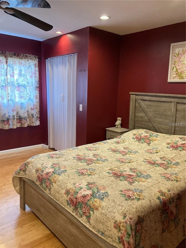 bedroom featuring hardwood / wood-style floors and ceiling fan