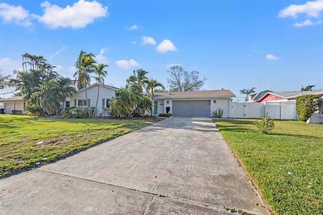 ranch-style house with a garage and a front lawn