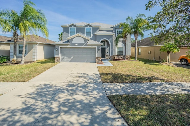 view of front of house featuring a garage and a front yard