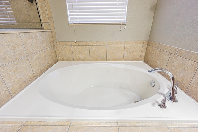 bathroom with tiled bath