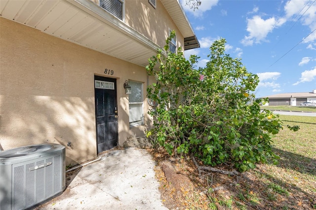 property entrance featuring central air condition unit