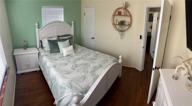 bedroom featuring dark wood-type flooring