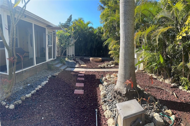 view of yard with a sunroom