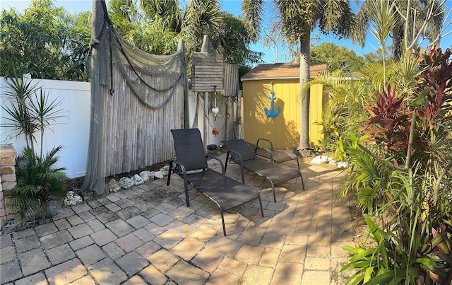 view of patio / terrace featuring a shed