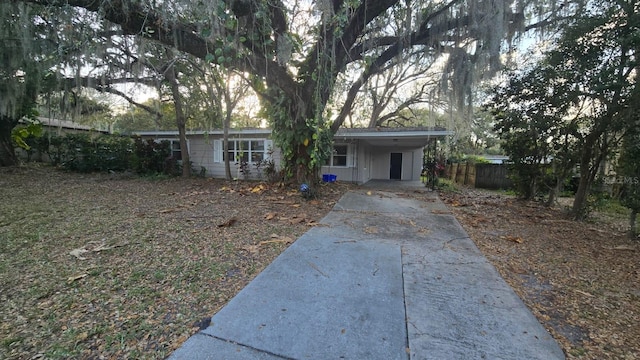 ranch-style home with a carport