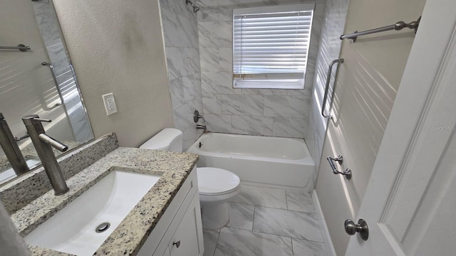 full bathroom featuring vanity, tiled shower / bath combo, and toilet