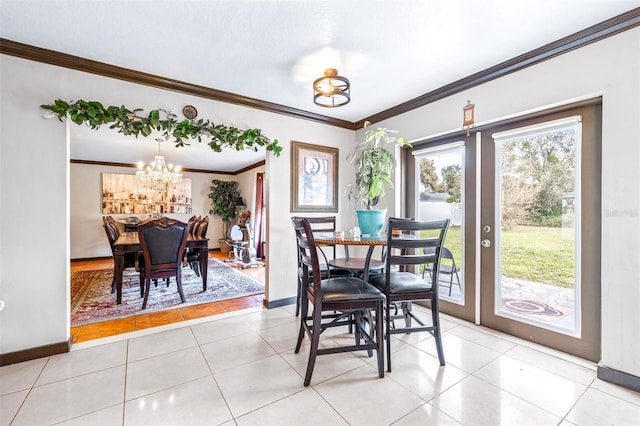 dining space featuring crown molding, a notable chandelier, light tile patterned floors, and french doors