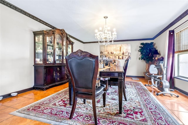 tiled dining room featuring an inviting chandelier and ornamental molding