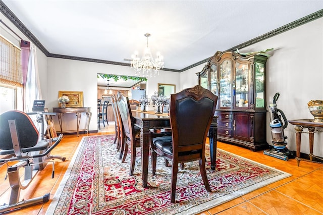 dining area with crown molding and a chandelier