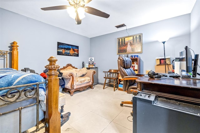 bedroom with ceiling fan and light tile patterned floors