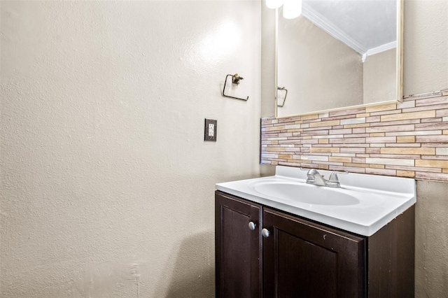 bathroom featuring vanity and decorative backsplash