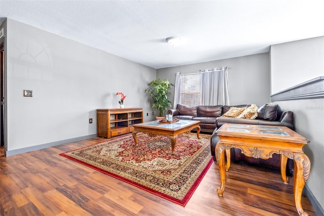 living room with hardwood / wood-style floors and a textured ceiling