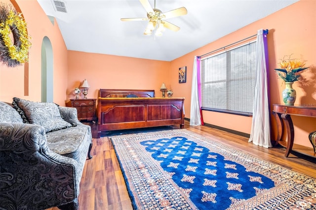 bedroom with ceiling fan and wood-type flooring