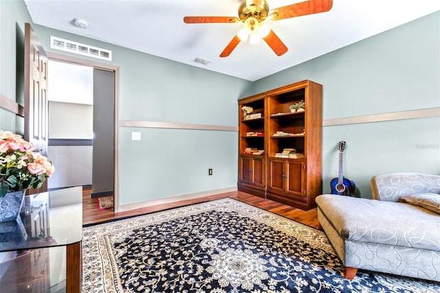 interior space with hardwood / wood-style flooring and ceiling fan