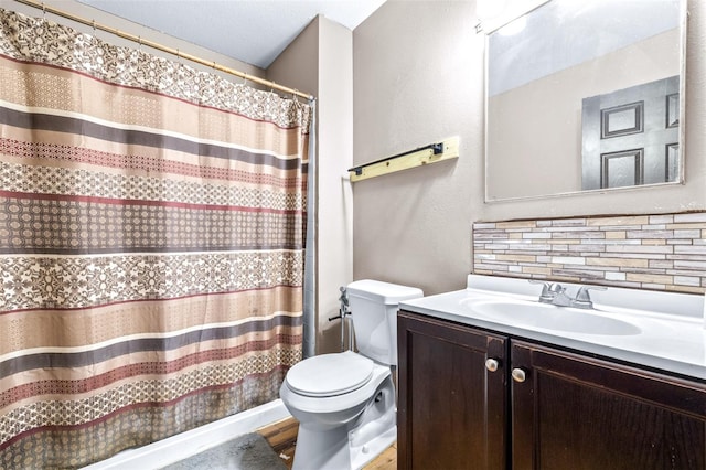 bathroom with tasteful backsplash, vanity, hardwood / wood-style flooring, and toilet