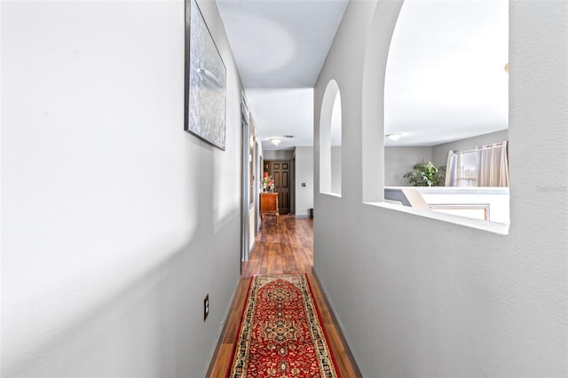 hallway with wood-type flooring