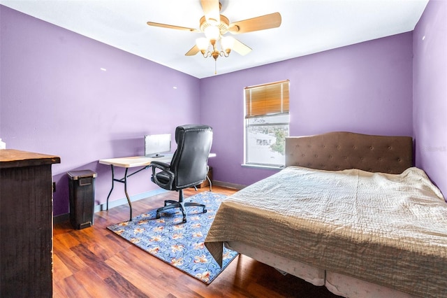 bedroom featuring hardwood / wood-style flooring and ceiling fan